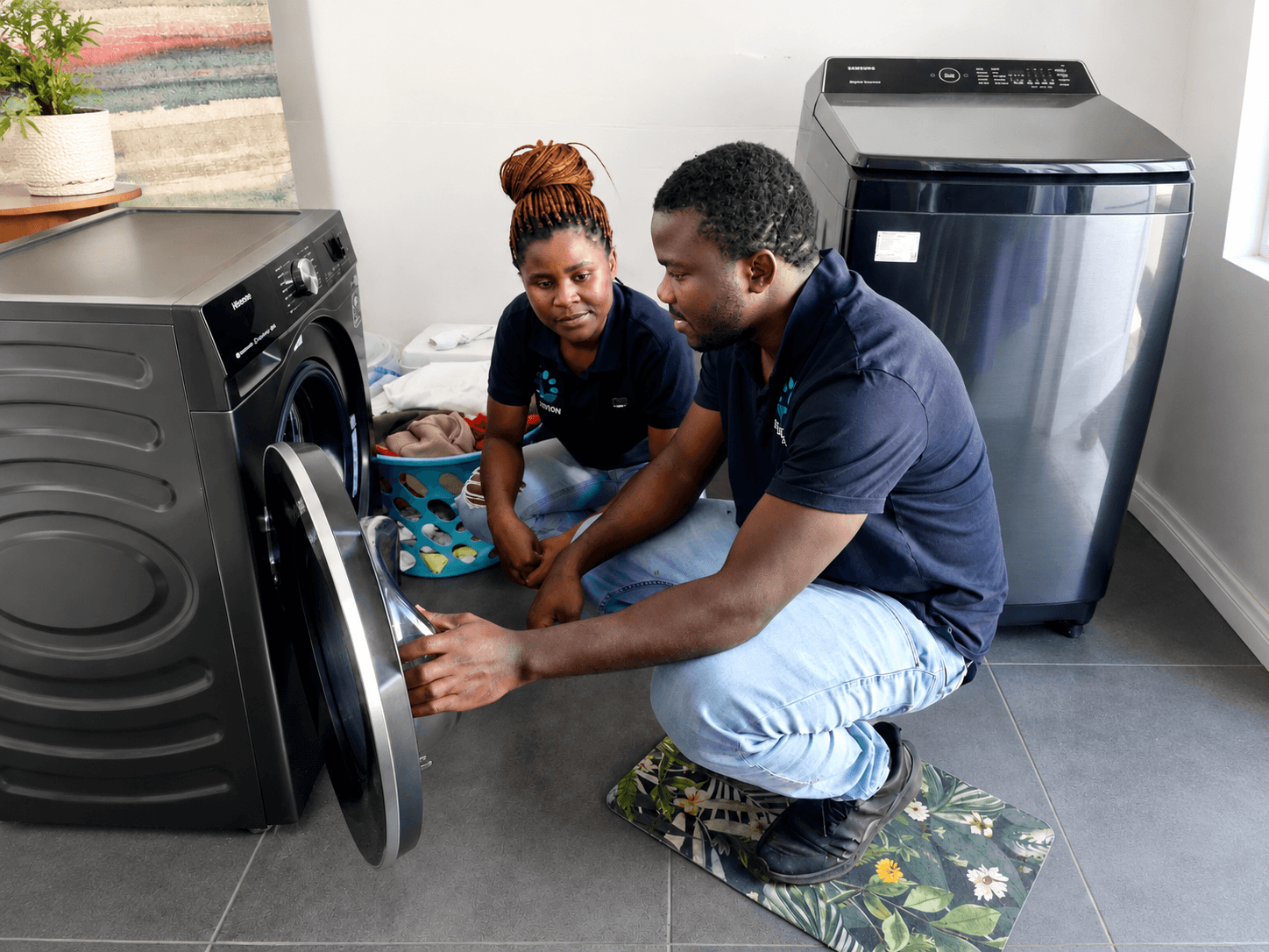 AE Refrigeration technician repairing a commercial display fridge